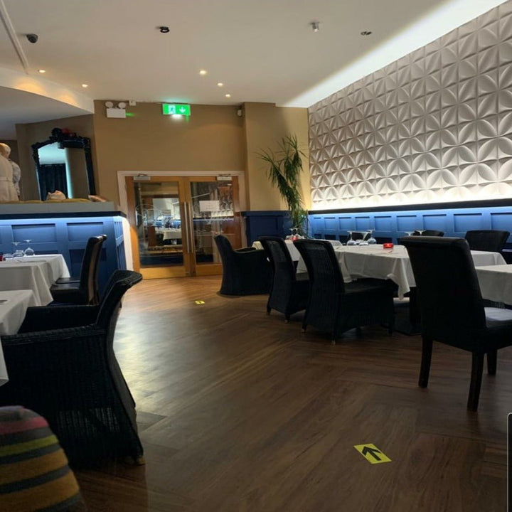 Interior view featuring Clover 3D PVC wall panels in a modern dining space